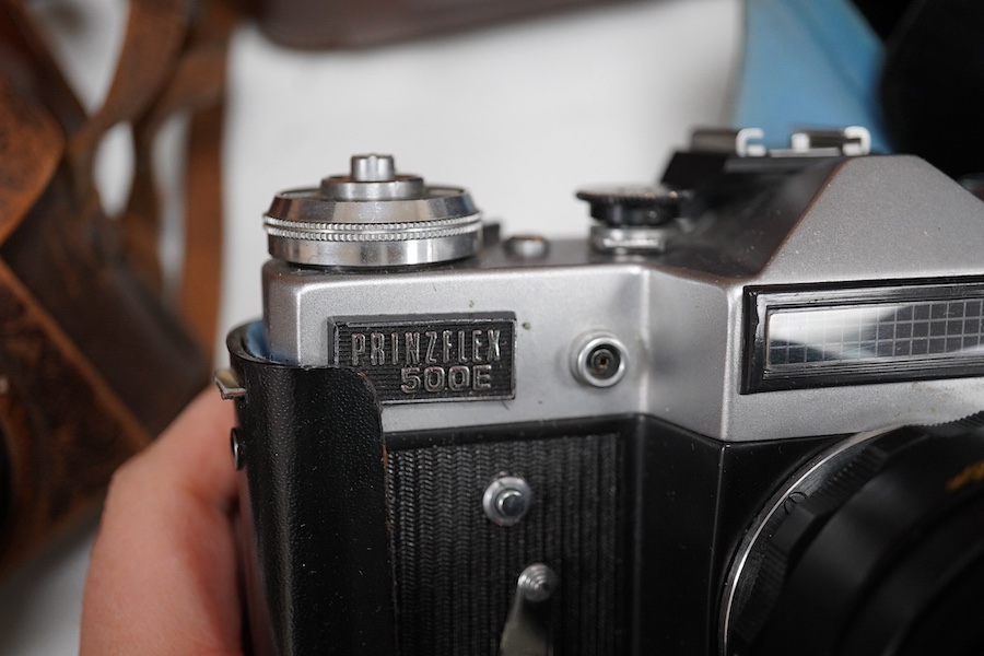 A Leica Model II camera in its original leather case, No. 204618, together with four additional cameras; a Zeiss Ikonta, a Zeiss Nettar, a Prinzflex 500E, and an Ensign Midget camera in its original card box with instruc